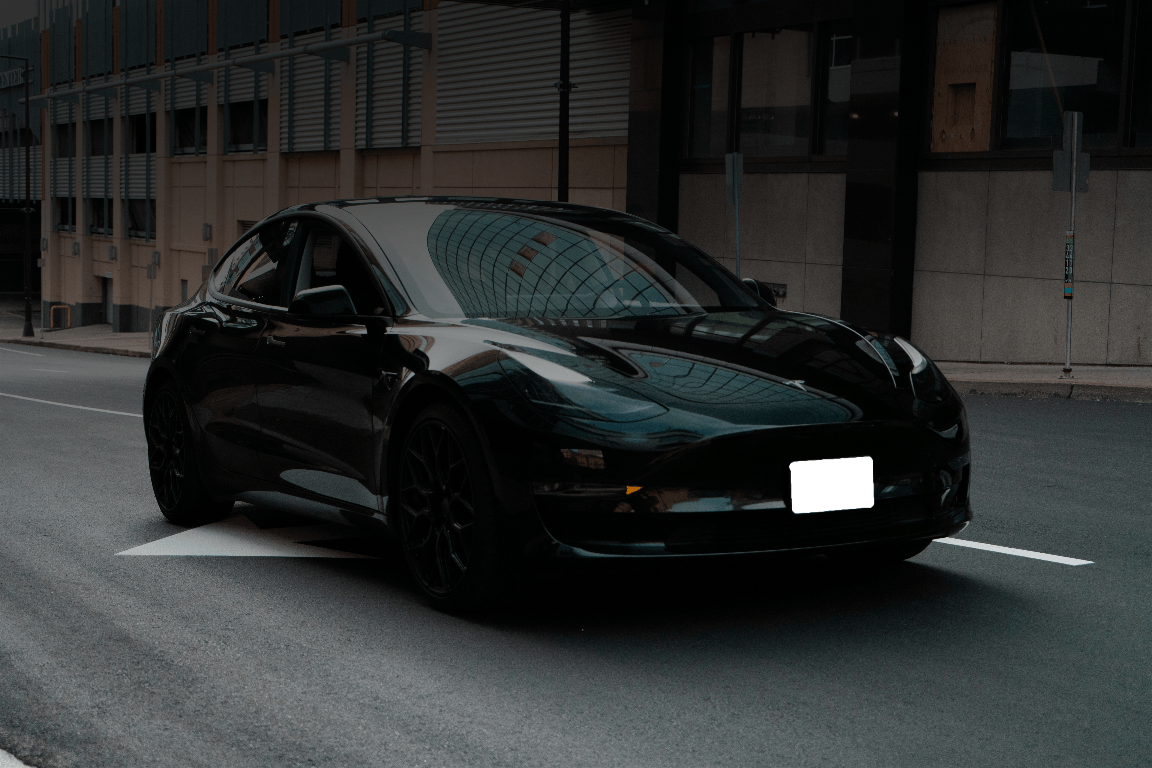 Modern Tesla service center with advanced automotive repair equipment and professional technicians